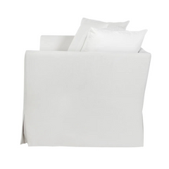 side image of white slipcovered chair by Our Boat House