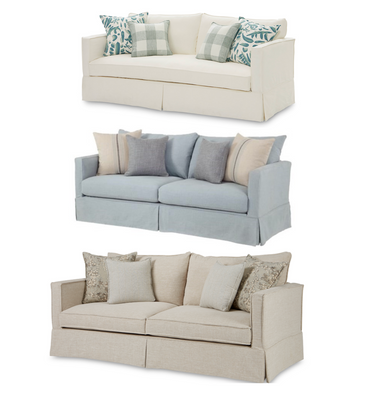 Beige sofa with patterned cushions on a white background