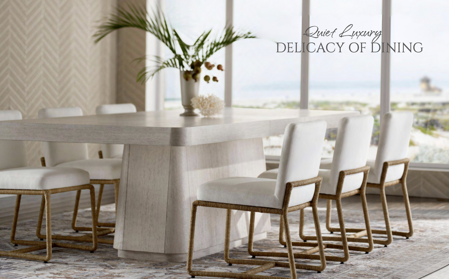 Dining room with a long white table and chairs, featuring the brand 'Quiet Luxury'.
